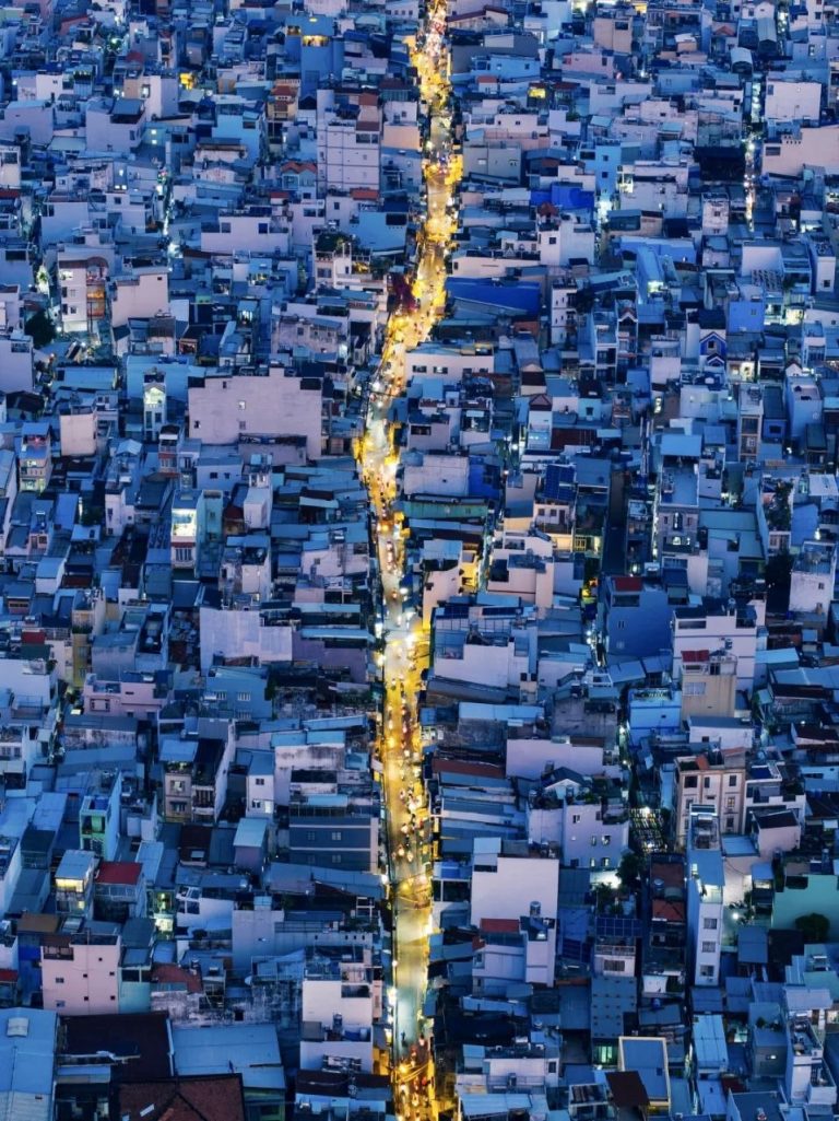 Dense urban neighborhood aerial view in Vietnam at dusk