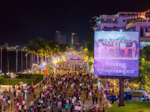 Phnom Penh riverside night crowd and street lights