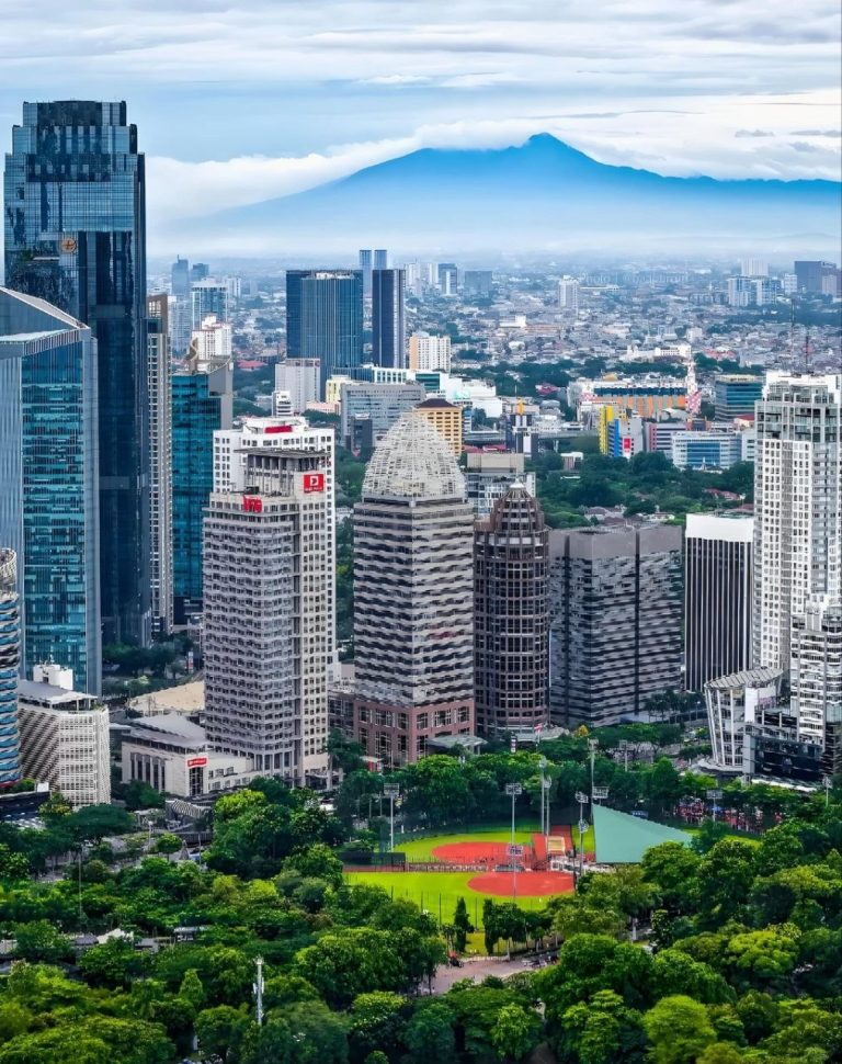 Jakarta skyline with mountains in the background