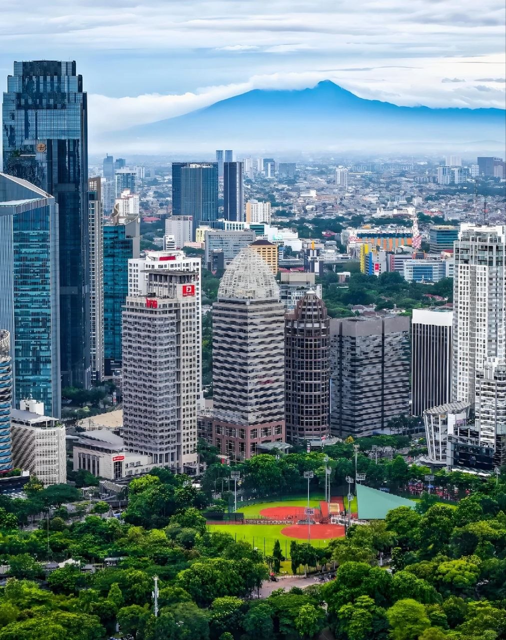 Jakarta skyline with mountains in the background