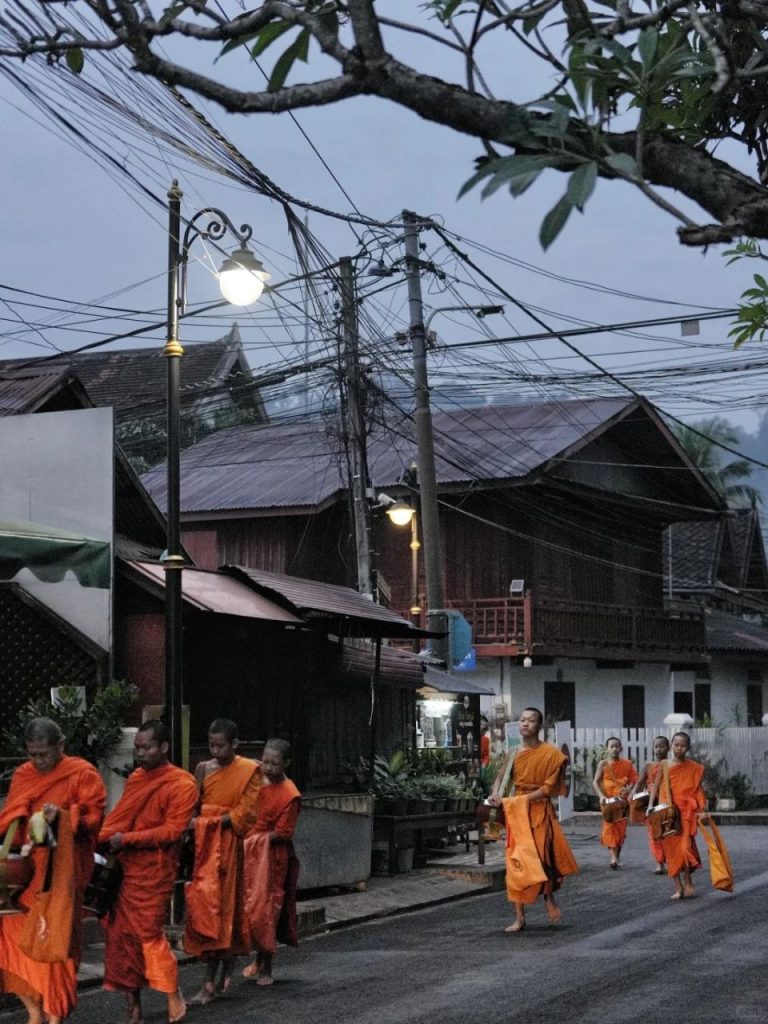 Luang Prabang monks walking in the early morning