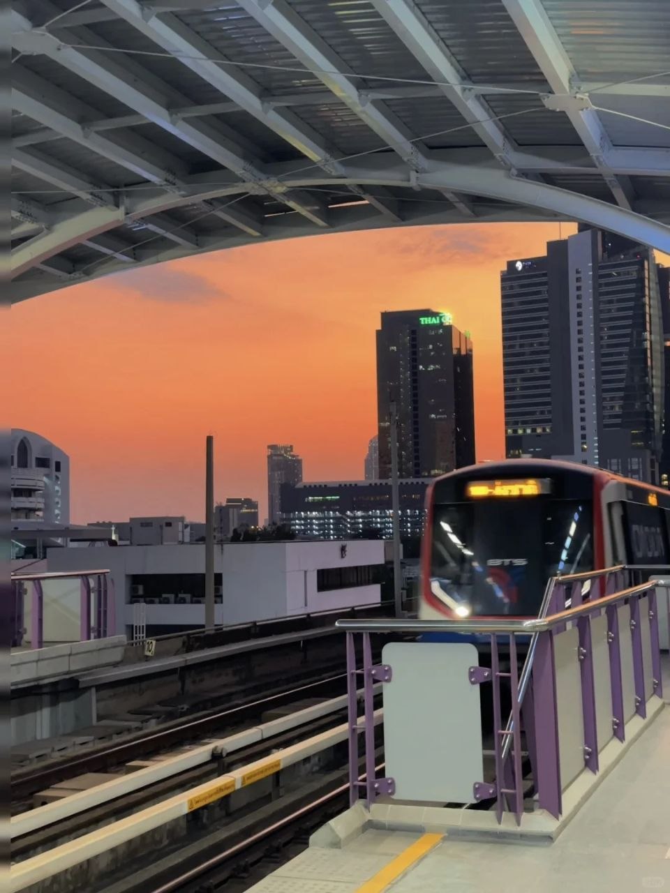 Bangkok BTS station and skyline at sunset