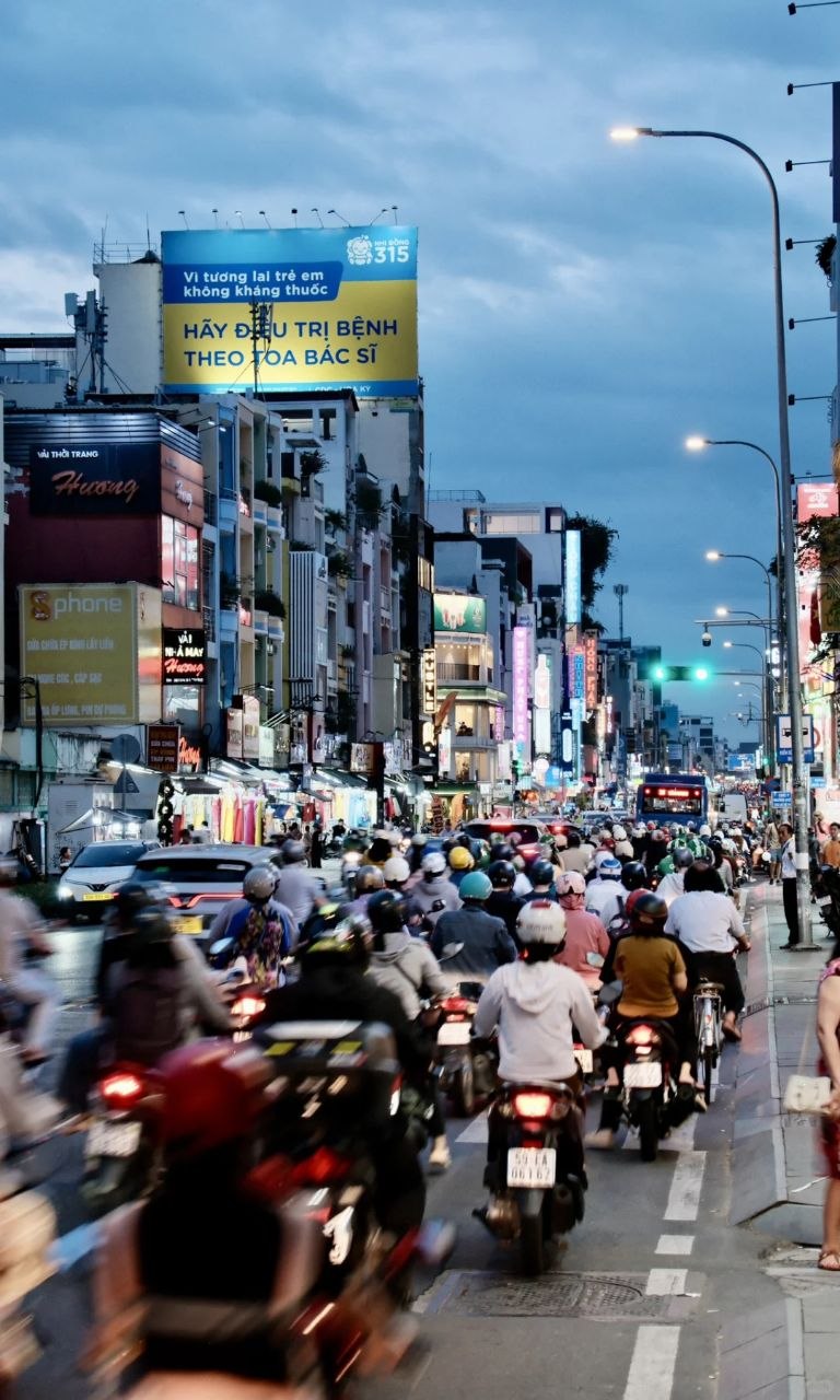 Ho Chi Minh City street traffic at dusk in Vietnam