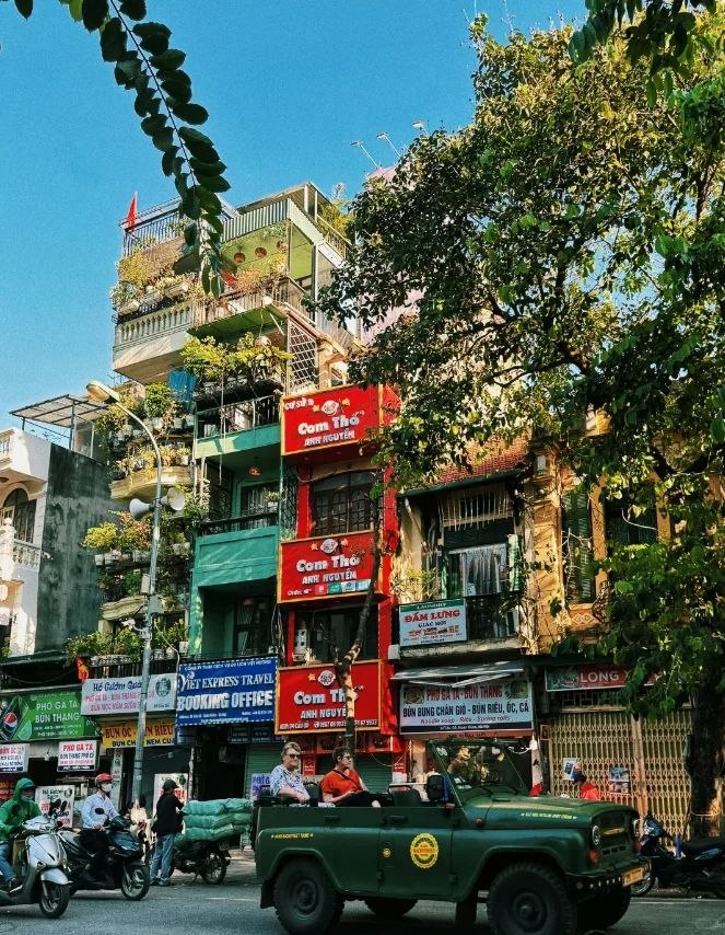 Street scene in Hanoi with local buildings and traffic